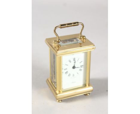 A SMALL ANGELUS BRASS CARRIAGE CLOCK. 3ins high in a folding leather case.