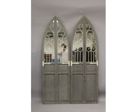 A PAIR OF ARCH TOP MIRRORED PANELS. 5ft 9ins high x 1ft 10ins wide.