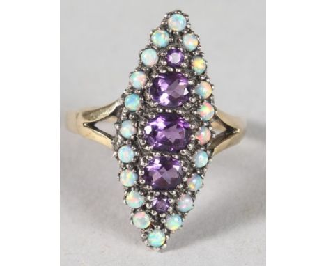 A 9CT GOLD, AMETHYST AND OPAL MARQUISE SET RING.