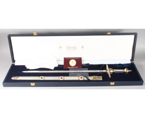 A WILKINSON E.R. PRESENTATION SWORD No. 0084, with metal and crystal handle. Engraved blade: Her Majesty Queen Elizabeth II G