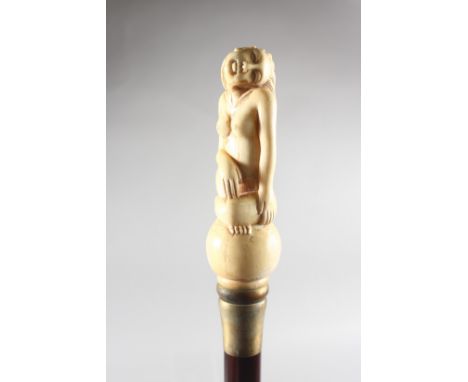 A WALKING STICK with carved bone handle of a nude.