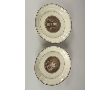 A PAIR OF FRENCH PORCELAIN DISHES, decorated to the centre with a portrait. 29cms diameter.
