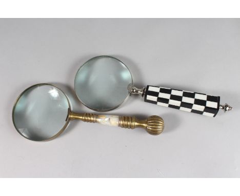 A MAGNIFYING GLASS with mother-of-pearl and metal handles.
