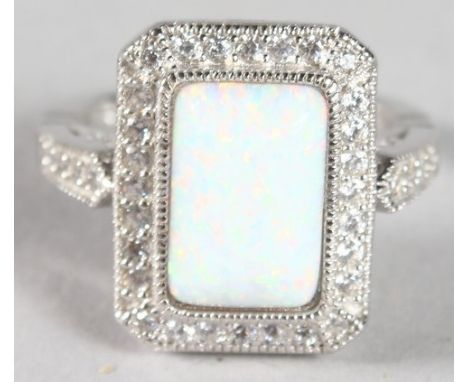 A SILVER OPAL DECO STYLE RING.
