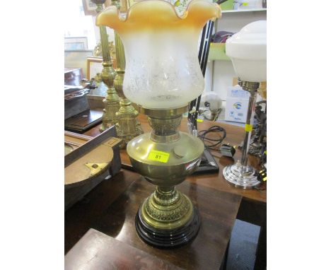 A Victorian oil lamp on black base having a glass funnel and frosted shade 