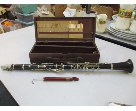 A vintage Hawkes and Son 'Excelsior Sonorous Class' clarinet numbered 8698, with fitted wooden caseLocation: 3:3 