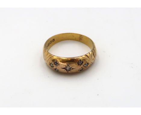 18ct gold diamond set band ring. Size N. Weight 2.39 grams. 