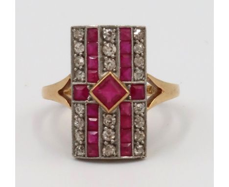An old cut diamond and ruby panel ring. Stamped 18ct. Ring size S. Weight 5.51 grams 