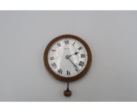 An open faced watch in  brass case, Roman numerals to chapter ring, retailed at Harrods 