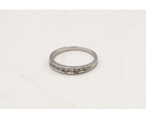 A 9ct gold brilliant cut half eternity ring. Diamond weight 0.25ct. Size J. Weight 1.3 grams 