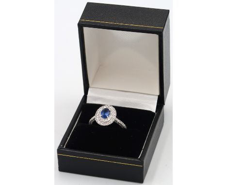 A quality platinum sapphire and diamond oval ring, sapphire a good colour surrounded by approx 1ct of diamonds, diamonds are 
