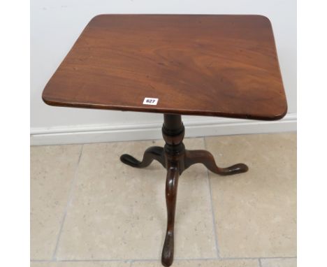 A Georgian rectangular tilt top occasional table on turned column terminating in tripod support. 57cm x 46cm x 68cm high. 