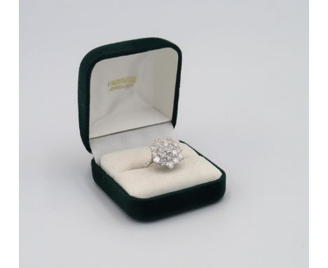 A bespoke hand made 18ct white gold diamond cluster ring with 19 0.15ct brilliant cut diamonds, making a total of 2.85cts. Co