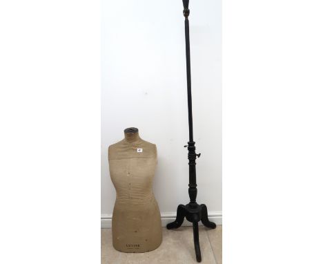A Dress mannequin on stand. 