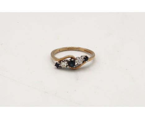 A 9ct gold sapphire and diamond five stone crossover ring. Size M. Weight 1.7 grams. 