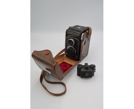 A Spy camera or espionage camera and a Yashica A 