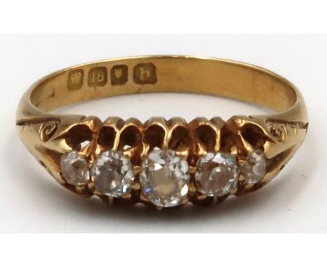 An 18ct gold graduated old cut diamond five stone ring. Estimated total diamond weight 0.50ct. Ring size O 1/2. Weight 3.61gr