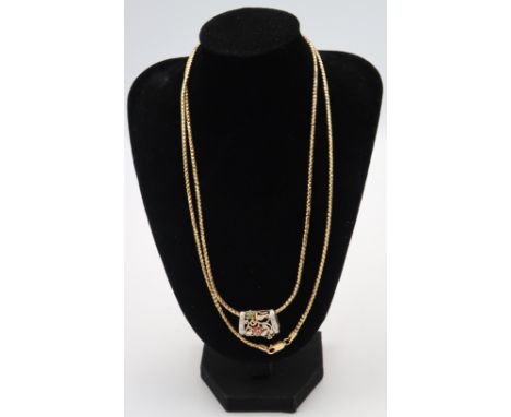 An emerald and ruby 925 silver gilt pendant and chain, head size approx 22mm x 18mm, chain approx 80cm long. Weight 32.78 gra