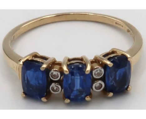 A 9ct yellow gold three stone kanite and white zircon ring, kanites are well matched, head size approx 17mm x 6mm, size R/S. 