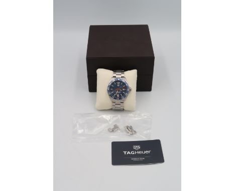 A Tag Heuer Formula 1 wristwatch in stainless steel with blue enamel dial. Boxed with papers.