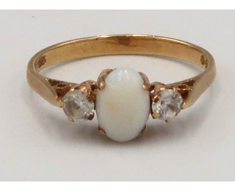 An 18ct gold opal and zircon three stone ring. Size L. Weight 2.0 grams. 