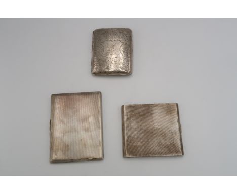 Three silver H.M. cigarette cases, two with engine turned decoration, one engraved, 13.33 Troy oz. 