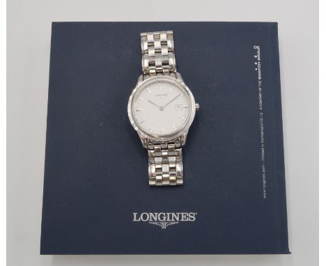 A Longines Flag Ship quartz watch model L4.716.4, original box and manual, includes 4 spare links in working order 