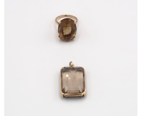 A smokey quartz pendant set in 9ct yellow gold with a 9ct yellow gold ring with oval cut smokey quartz to shoulder - ring siz