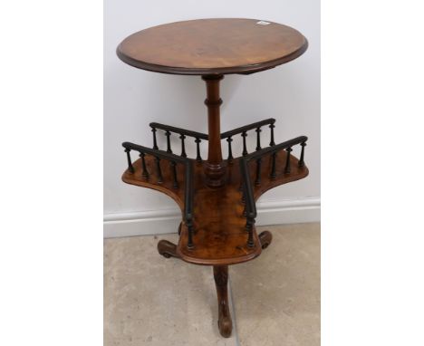 A Walnut two tier occasional table with circular top 44.5cm dia. lower triform galleried tier raised on turned column termina