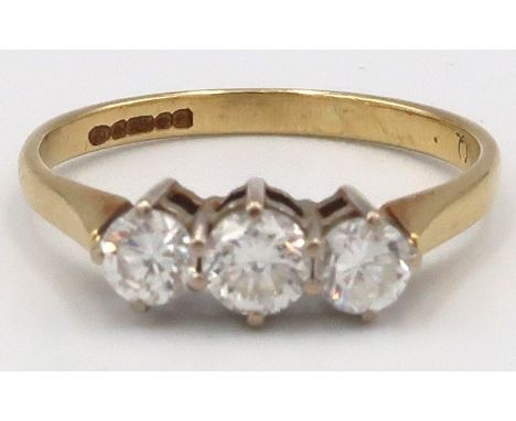 An 18ct Yellow Gold three stone diamond ring. Estimated total diamond weight 0.65ct. Estimated colour G/H. Estimated clarity 