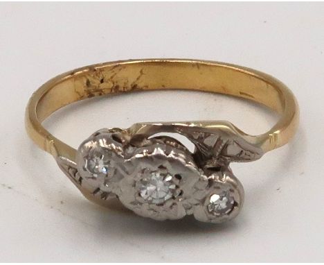 A single cut diamond three stone crossover ring. Size K. Tested gold 18ct. Weight 3.2 grams. 