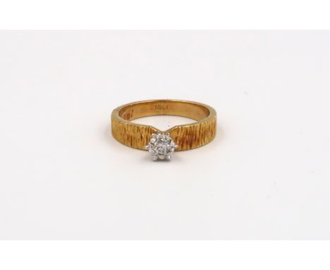 An 18ct Yellow Gold Solitaire ring with moissanite stone to shoulder 4.96 grams. Size 