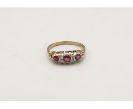 A 9ct gold ruby and diamond dress ring. Size O. Weight 1.7 grams. 