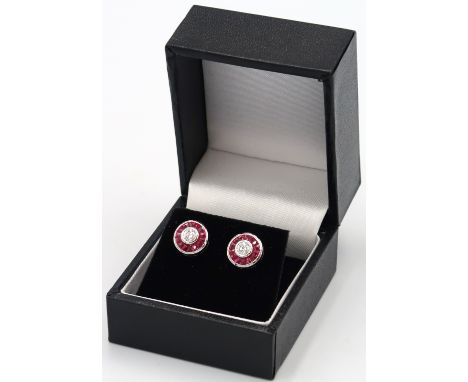 A pair of good quality 18ct white gold ruby and diamond earrings, retailed by Luke Stockley of London, head size approx 10mm 