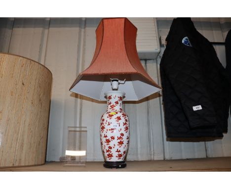 An Oriental floral decorated table lamp and shade 