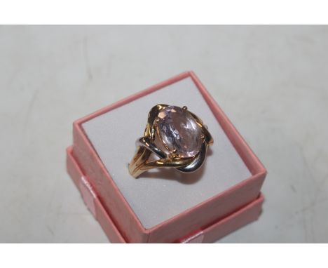 A large two tone Sterling silver and amethyst ring