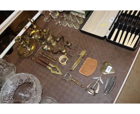 A quantity of various brassware, nut crackers, chamber stick and a 1938 military pocket knife