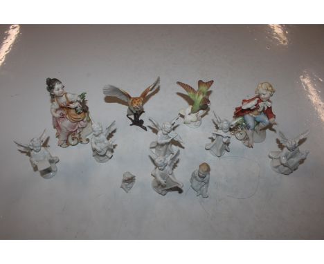 A box of ornaments and figurines to include Crown Staffordshire model of a humming bird, a barn owl and various cherubs