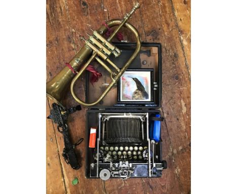 An early 20th century Corona folding typewriter, together with a brass horn by F Besson, Euston Road London (af), a taxidermy