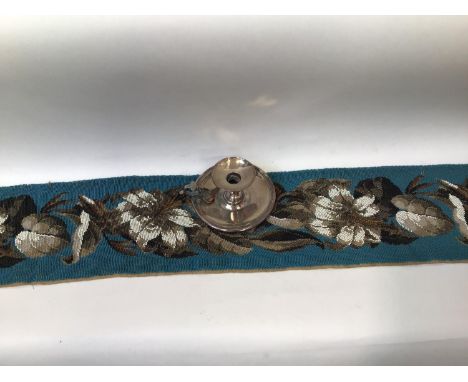 A heavy Victorian beadwork panel depicting scrolling lilies to a turquoise beaded ground, 130cm long, together with a silver-