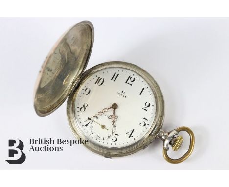 Vintage Omega silver cased pocket watch. The watch having a white enamel face with numeric dial, subsidiary minute dial, move