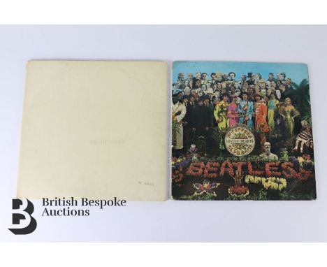 The White Album by The Beatles, early number no 0000261, in gatefold sleeve with photographs and poster insert, and a Sgt. Pe