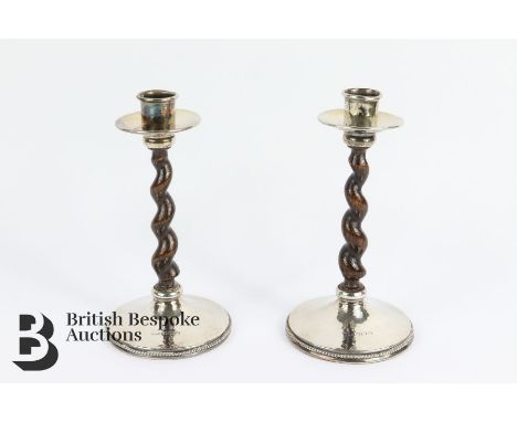 Two hammered silver Arts and Crafts candlesticks with wood twisted stems hallmarked Birmingham 1922 mm Albert E. Jones, appro