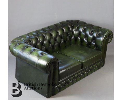 Green leather two seater button back sofa, approx 160 cms length x 89 cms. (af)The leather is in good condition however the f