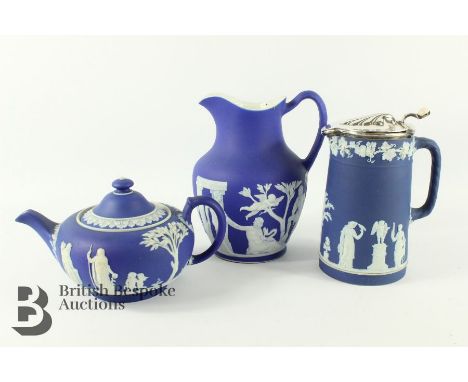Collection of cobalt Wedgwood china, including a pitcher with silver plated cover approx 20 cms h, a water jug depicting clas