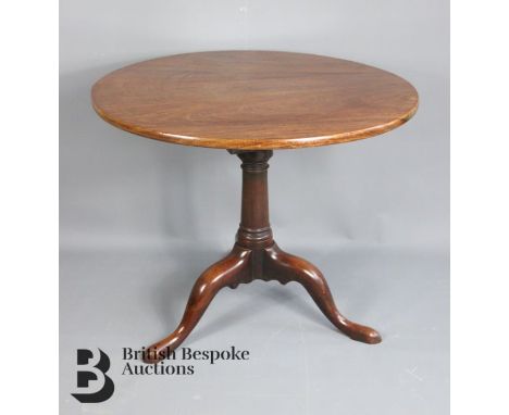 A 19th Century mahogany tripod table, circular top on gun barrel column, birdcage on cabriole legs, measures approx. 86cm dia