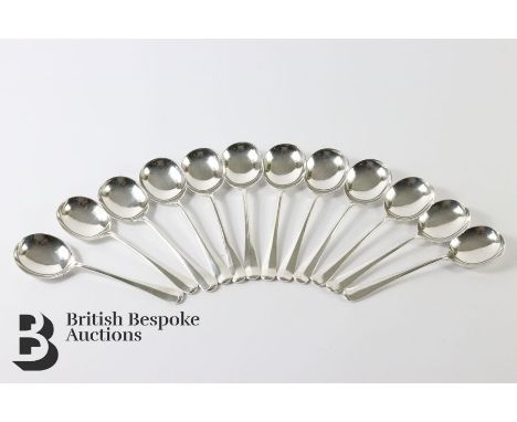 Twelve silver rat tail Hanoverian pattern bouillon spoons, makers mark SBS, dated 1969, approx 750 gms.