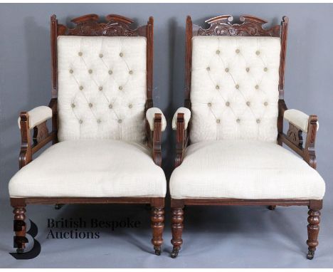 Pair of late Victorian mahogany button back arm chairs, supported on ring turned tapered legs.&nbsp;