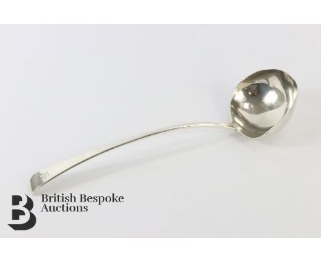 A Georgian silver soup ladle, dated 1791 makers mark rubbed, approx 175 gms (misshaped bowl).