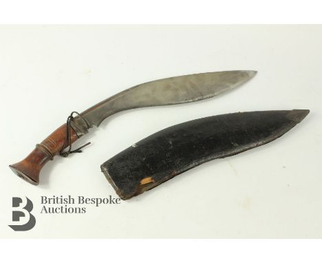 Genuine Nepalese war era khukri, blade approx 30 cms, housed in a leather covered wooden scabbard.&nbsp;